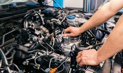 mechanic working on engine repairs, close up